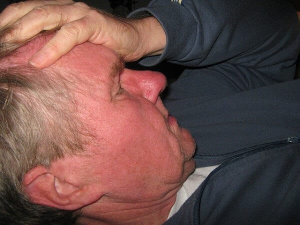 Man suffering with dehydration headache